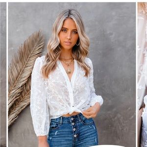 VICI brand medium sheer white floral top.